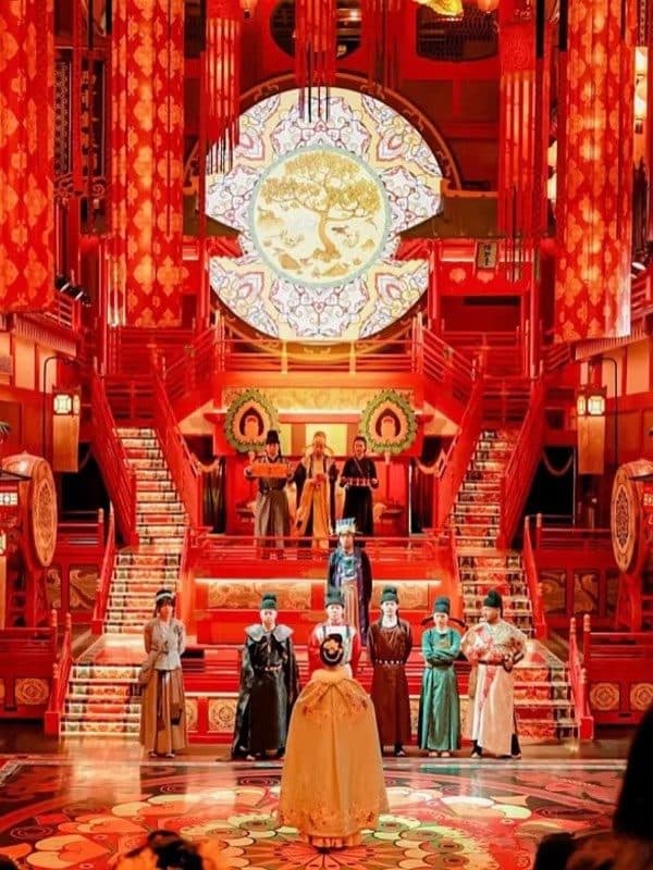 Performance on a red-lit temple stage